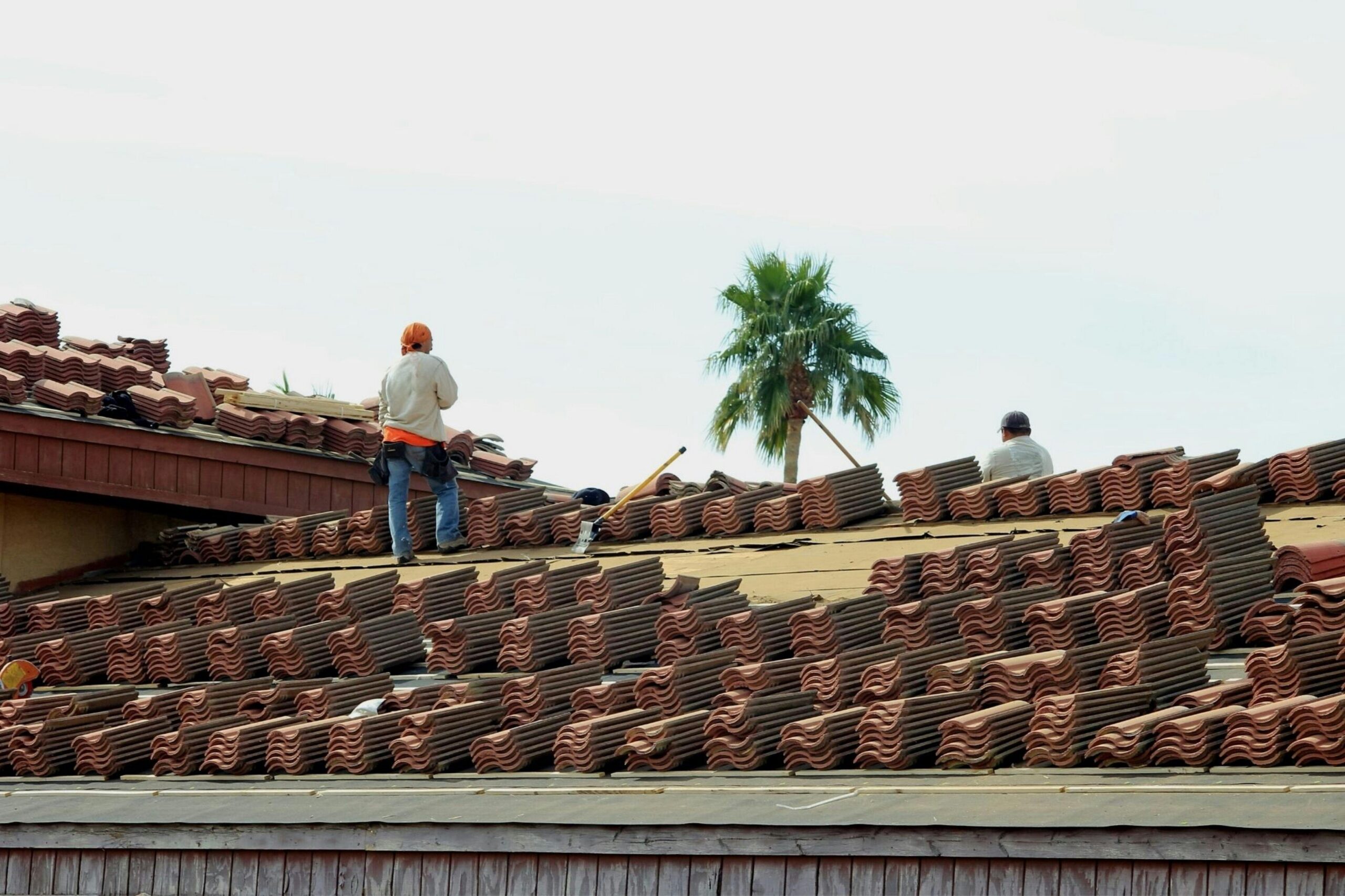 Roofing contractors installing tile roof in Southern California
